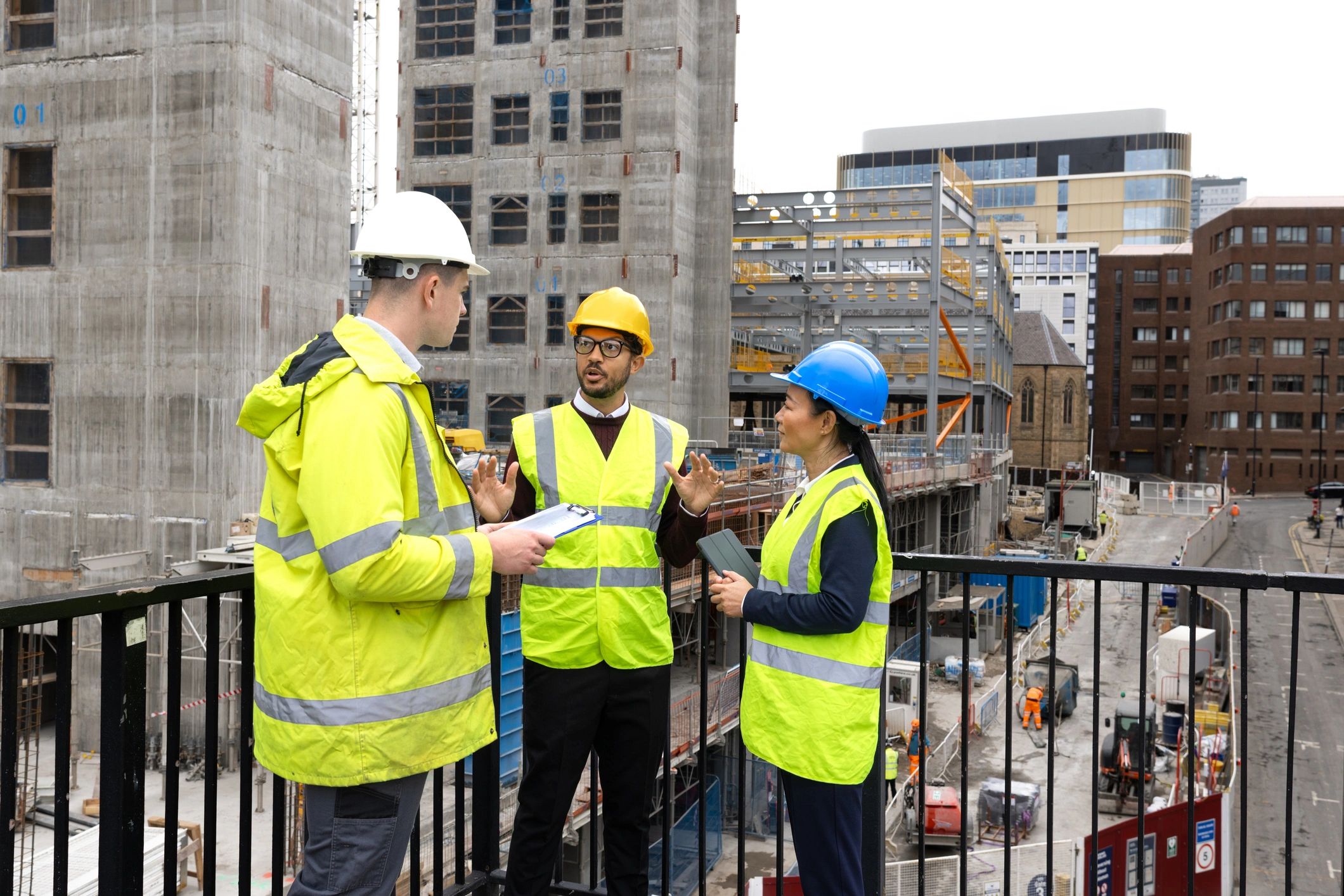 Construction team reviewing plans together on site